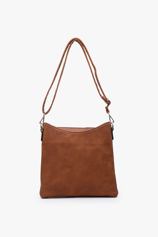 Brown leather handbag with a strap on a white background
