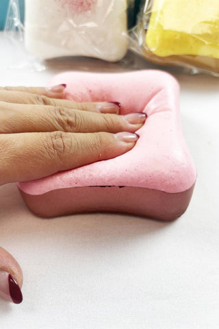 Scented Slow Rising Toast Squishy Toy in pink, white, and yellow