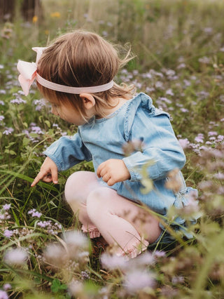 Light Wash Denim Long Sleeve Flutter Bubble Romper