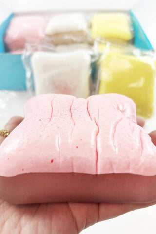 Scented Slow Rising Toast Squishy Toy in pink, white, and yellow