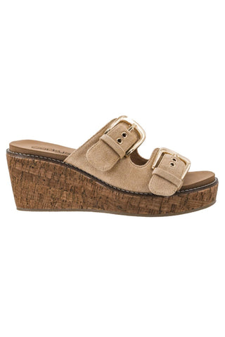 A single women's wedge slide sandal in beige suede with two adjustable buckle straps and a thick brown cork-textured wedge heel, shown against a plain white background.