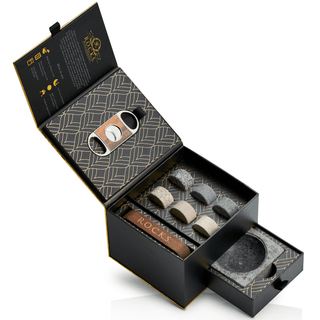 Cigar stone set with a caddy and cutter in an open black box on a white background