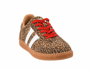 A low-top sneaker featuring a brown and black leopard print pattern, a white side stripe, bright red laces, and a brown gum sole, shown against a plain white background.