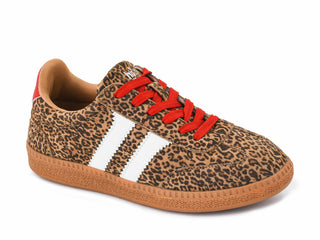 A low-top sneaker featuring a brown and black leopard print upper, white side stripes, bright red laces, and a brown gum sole, shown on a plain white background.