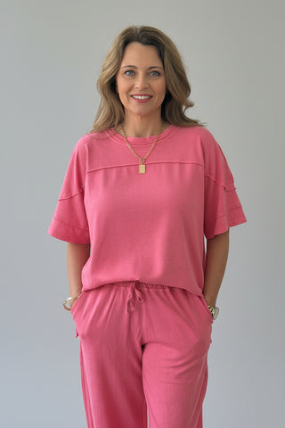 Woman in pink lounge outfit 