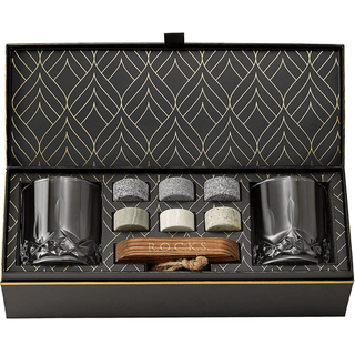 Set of rocks glasses and accessories in a decorative box with geometric pattern
