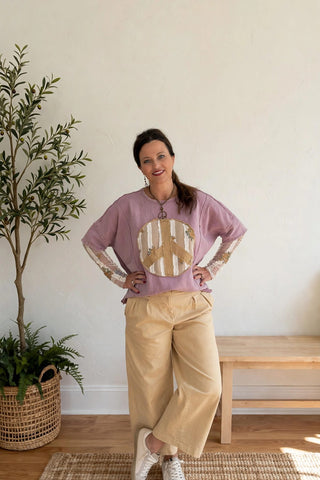 Mauve Easel top with peace sign and sheer sleeves.