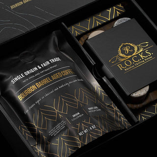 Coffee package with 'R.O.C.K.S.' branding and coffee chilling stones in a black box.