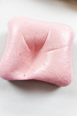 Scented Slow Rising Toast Squishy Toy in pink, white, and yellow
