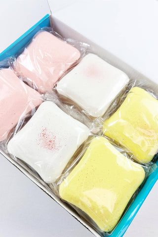 Scented Slow Rising Toast Squishy Toy in pink, white, and yellow