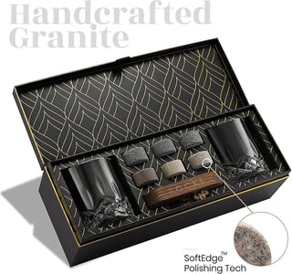 Handcrafted granite product set with two black cups and stones in a decorative box.