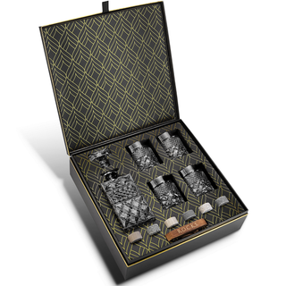 Set of glass decanters and rocks in a decorative box with geometric pattern